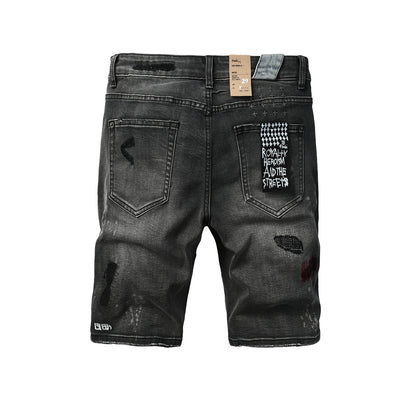 Shorts vaqueros desgastados negros lavados para hombre con parches de grafiti y detalles de estilo urbano (2009) 