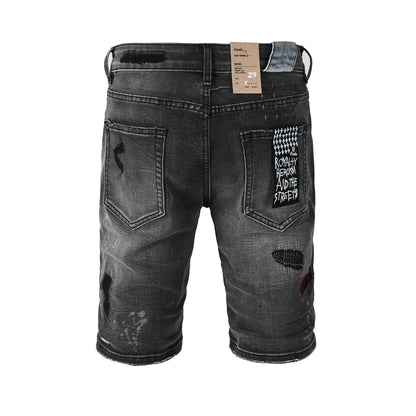 Shorts vaqueros desgastados negros lavados para hombre con parches de grafiti y detalles de estilo urbano (2009) 