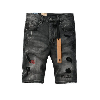 Shorts vaqueros desgastados negros lavados para hombre con parches de grafiti y detalles de estilo urbano (2009) 
