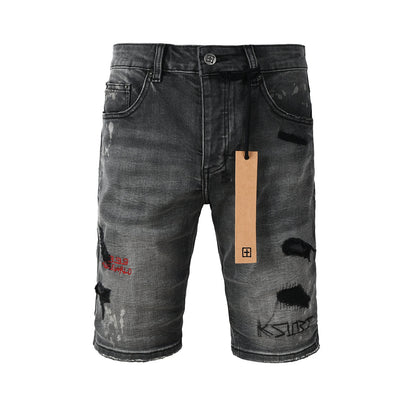 Shorts vaqueros desgastados negros lavados para hombre con parches de grafiti y detalles de estilo urbano (2009) 