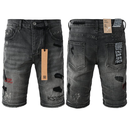 Shorts vaqueros desgastados negros lavados para hombre con parches de grafiti y detalles de estilo urbano (2009) 