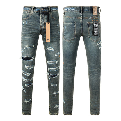 Jean skinny bleu foncé pour homme, très déchiré, avec effet usé et patch graphique au dos, pour un style urbain 3049 