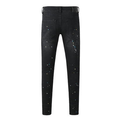 Jean slim déchiré noir pour homme, style streetwear, effet éclaboussures de peinture multicolores et détails déchirés 9121 