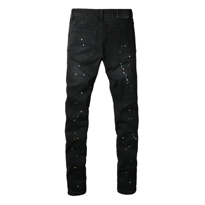 Jean slim déchiré noir pour homme, style streetwear, effet éclaboussures de peinture multicolores et détails déchirés 9121 
