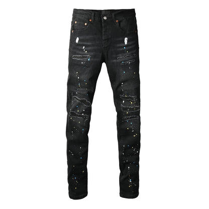 Jean slim déchiré noir pour homme, style streetwear, effet éclaboussures de peinture multicolores et détails déchirés 9121 